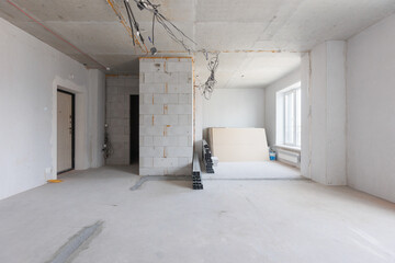 interior of the apartment without decoration in gray colors. rough finish