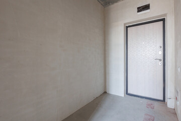interior of the apartment without decoration in gray colors. rough finish