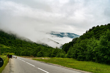 road in the mountains early in the morning in the mountains, veils of fog and clouds slope in the mountains, Transfagarasan, Transylvania Romania