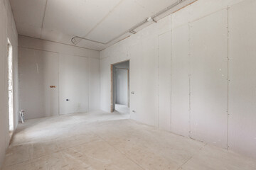 interior of the apartment without decoration in gray colors. rough finish