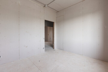interior of the apartment without decoration in gray colors. rough finish