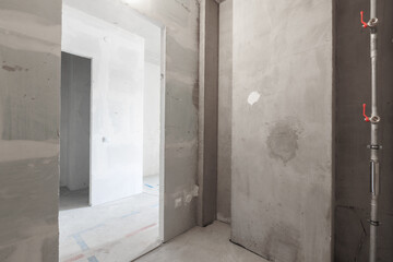 interior of the apartment without decoration in gray colors. rough finish