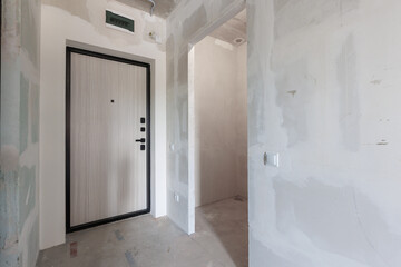 interior of the apartment without decoration in gray colors. rough finish