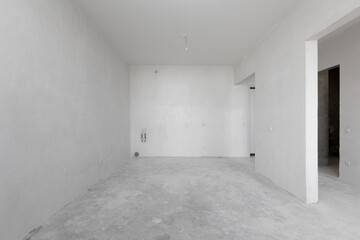 interior of the apartment without decoration in gray colors. rough finish