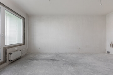 interior of the apartment without decoration in gray colors. rough finish