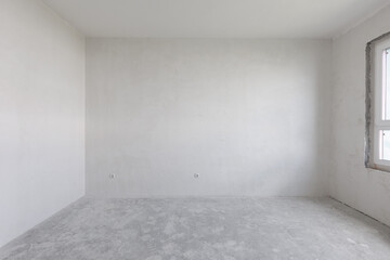 interior of the apartment without decoration in gray colors. rough finish