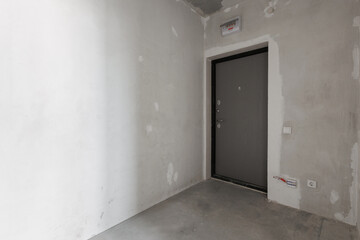 interior of the apartment without decoration in gray colors. rough finish