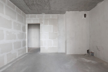 interior of the apartment without decoration in gray colors. rough finish