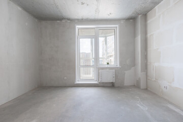 interior of the apartment without decoration in gray colors. rough finish