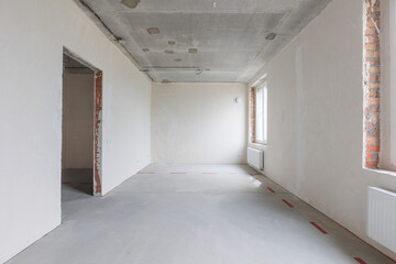 interior of the apartment without decoration in gray colors. rough finish