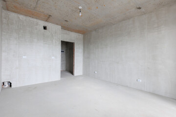 interior of the apartment without decoration in gray colors. rough finish