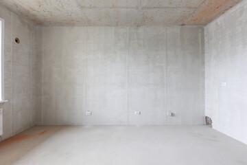 interior of the apartment without decoration in gray colors. rough finish