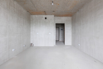interior of the apartment without decoration in gray colors. rough finish