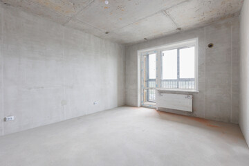 interior of the apartment without decoration in gray colors. rough finish