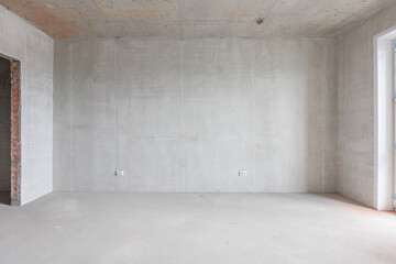interior of the apartment without decoration in gray colors. rough finish