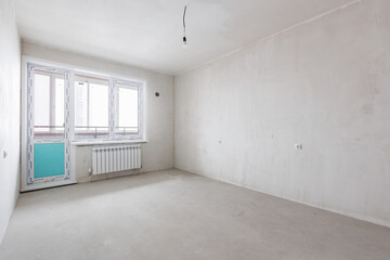 interior of the apartment without decoration in gray colors. rough finish