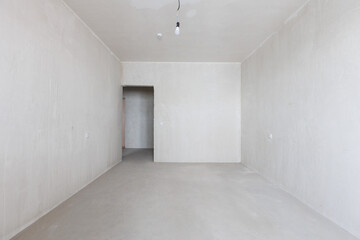 interior of the apartment without decoration in gray colors. rough finish