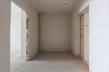 interior of the apartment without decoration in gray colors. rough finish