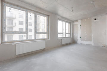 interior of the apartment without decoration in gray colors. rough finish