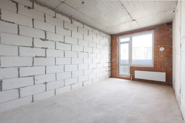 interior of the apartment without decoration in gray colors. rough finish