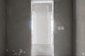 interior of the apartment without decoration in gray colors. rough finish