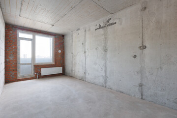 interior of the apartment without decoration in gray colors. rough finish