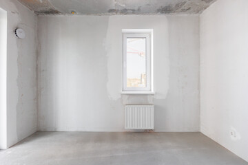 interior of the apartment without decoration in gray colors. rough finish