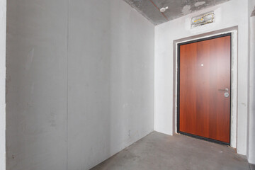 interior of the apartment without decoration in gray colors. rough finish