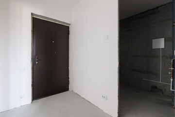 interior of the apartment without decoration in gray colors. rough finish