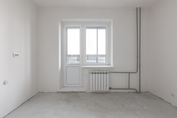 interior of the apartment without decoration in gray colors. rough finish
