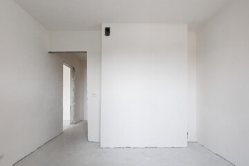 interior of the apartment without decoration in gray colors. rough finish