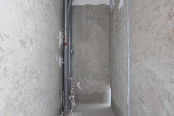 interior of the apartment without decoration in gray colors. rough finish