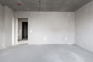 interior of the apartment without decoration in gray colors. rough finish