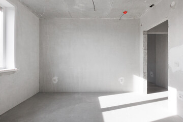 interior of the apartment without decoration in gray colors. rough finish