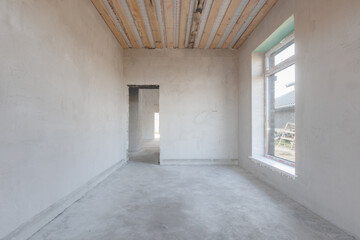 interior of the apartment without decoration in gray colors. rough finish