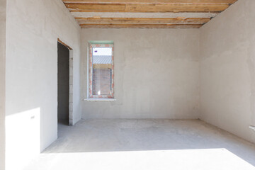 interior of the apartment without decoration in gray colors. rough finish