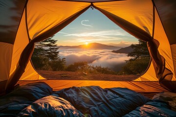 Sunrise view from inside a tent overlooking a mist covered mountain range.