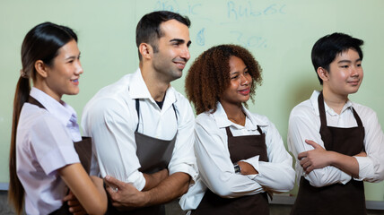 Barista learning make coffee by espresso machine. Group schoolgirl studying hard to learn how to make espresso coffee at barista school. Barista coffee training workshop