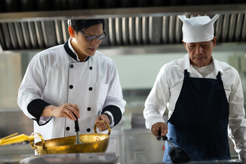Group of student learning. Cooking class. culinary classroom. group of happy mature man and young...