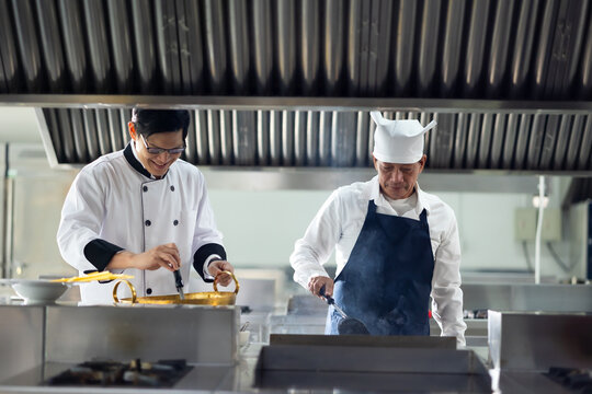 Group of student learning. Cooking class. culinary classroom. group of happy mature man and young woman multi - ethnic students are focusing on cooking lessons in a cooking school.
