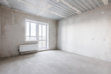 interior of the apartment without decoration in gray colors. rough finish