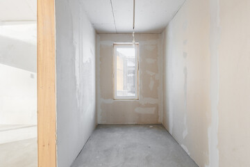 interior of the apartment without decoration in gray colors. rough finish