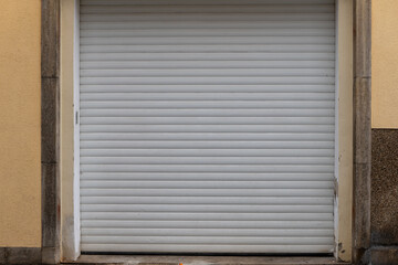 closed garage door with roller shutter