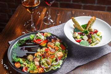 salad with grilled vegetables roast beer and Salad with prosciutto slices of grapes and cherry tomatoes, dark and moody, top new