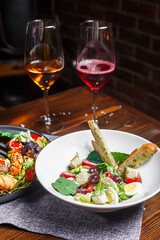 salad with grilled vegetables roast beer and Salad with prosciutto slices of grapes and cherry tomatoes, dark and moody, top new
