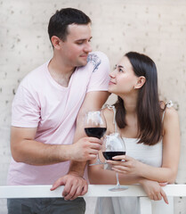 Couple enjoying a glasses of red wine