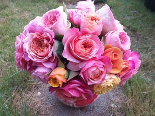 A bouquet of pink roses with an orange heart. Miyabi variety.