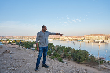 Sunset over the Nile River in the city of Aswan with sandy and deserted shores