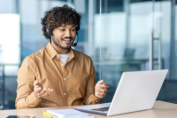 Worker with headset phone for video call talking to buyers customers consulting remotely,...