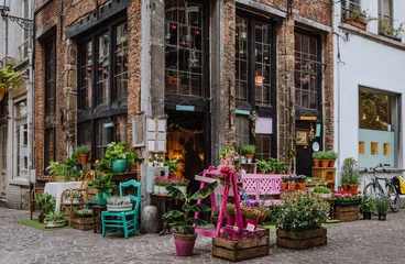 Fototapeten Old street with flower shop in historic city center of Antwerpen (Antwerp), Belgium. Cozy cityscape of Antwerp. Architecture and landmark of Antwerpen © Ekaterina Belova